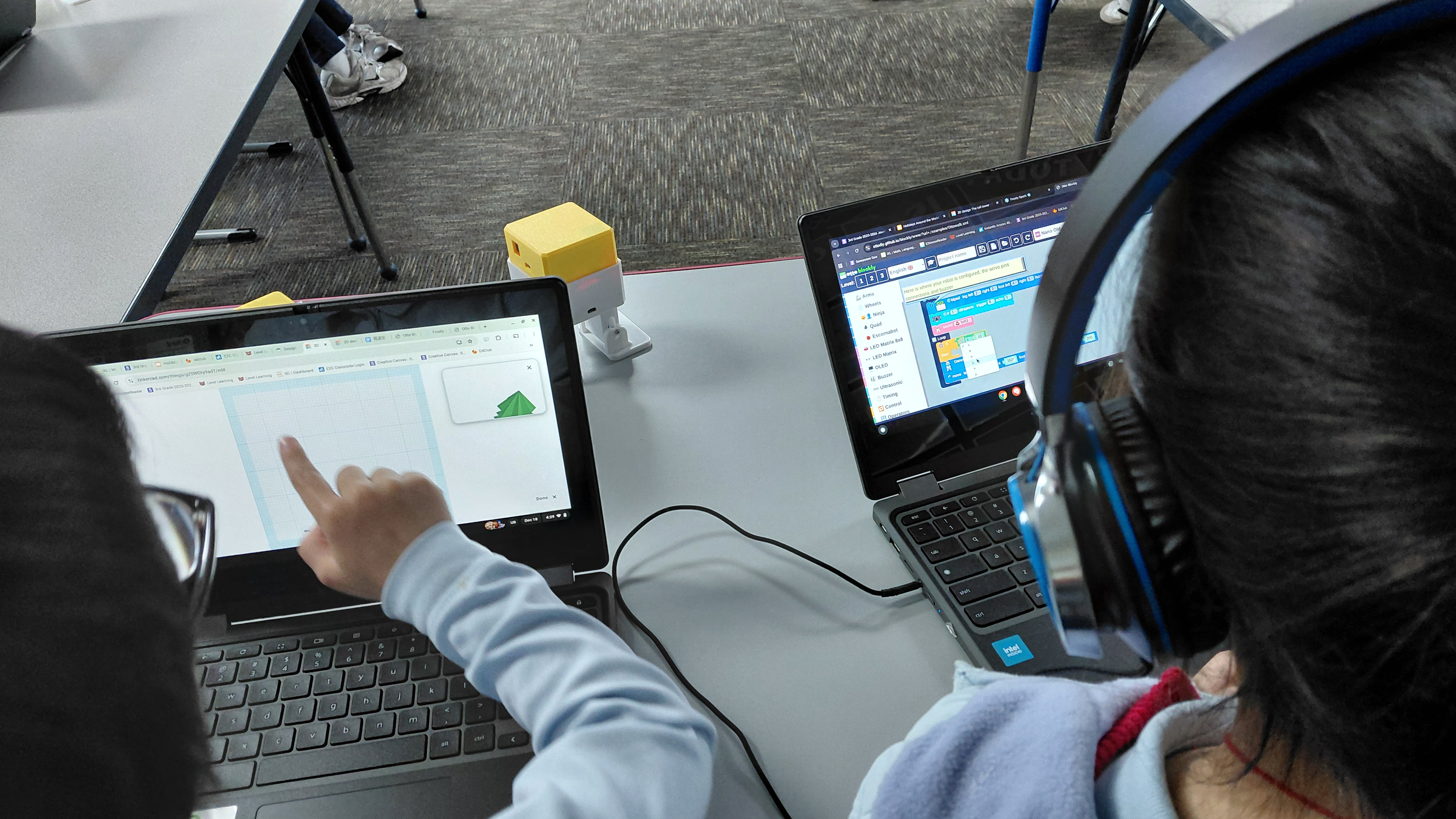 Classroom display showing Otto DIY block coding game on a large interactive screen